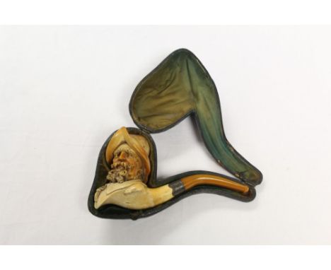 Late 19th century meerschaum pipe carved with the head of a bearded Spanish Conquistador wearing helmet, with silver collar a