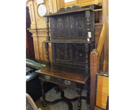 A 19th Century Oak table with carved shelf back, on turned legs