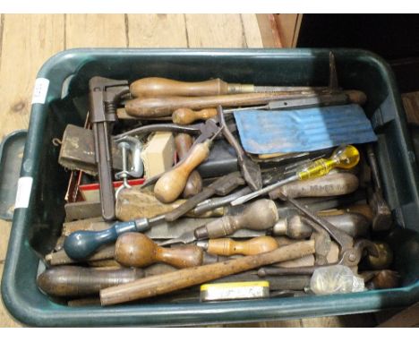 A large tub containing various woodworking and other tools