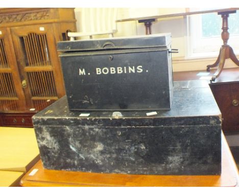 A tool box and a tin trunk