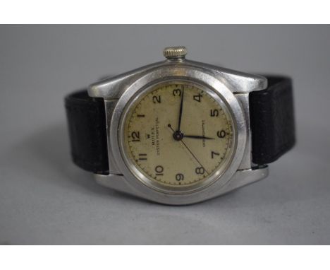 A 1940s Rolex Oyster Perpetual Chronometer Wristwatch. Circa 1940. Stainless Steel, Arabic Numeral Dial, Black Baton Hands, N