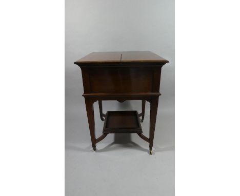 An Edwardian Mahogany Surprise Table with Rise and Fall Mechanism to Fitted Interior with Three Decanters in Tantalus Frame i