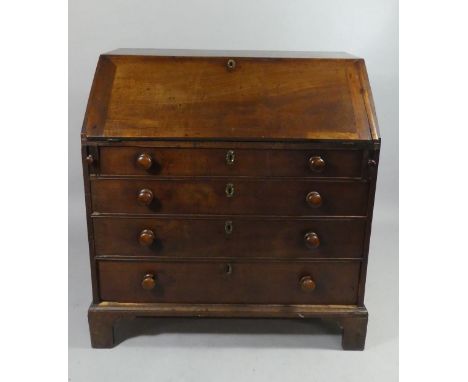 A Georgian Mahogany Fall Front Bureau with Fitted Interior, Four Long Drawers and Bracket Feet. 99.5cms Wide 