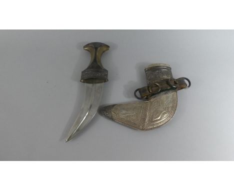 A White Metal and Horn Mounted Omani Khanjar/Jambiya Dagger with Felting to One Side. 30cms Long 
