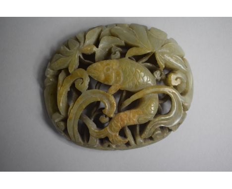 A Nice Quality Carved and Pierced Jade Amulet depicting Fish in Reeds. 8x6.5cms 