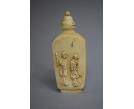 A Chinese Ivory Snuff Bottle of Rectangular Form with Rounded Sloping Shoulders set on Raised Foot with Carved Decoration Dep