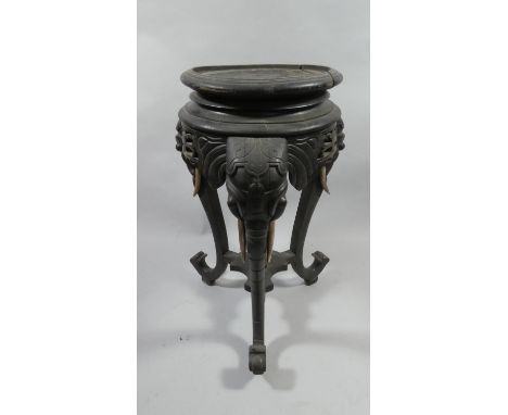 An Anglo Indian Vase Stand of Tripod Form. The Supports in the Form of Three Elephant Heads. Circular Top. 75cms High 