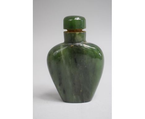 A Chinese Spinach Green Jade Snuff Bottle of Tapered Spade Form complete with Stopper. 6cms High 