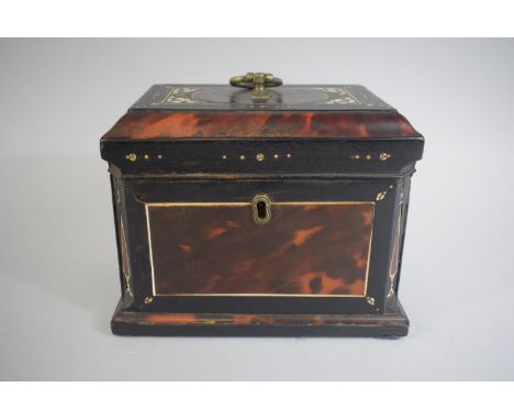 A Mother of Pearl Inlaid Tortoiseshell Tea Caddy of Sarcophagus Form with Canted Sides. 18x12x14cms 