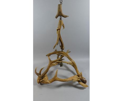 An Early th Century Black Forest Antler Pendant Light Fitting. 46x58cms High 