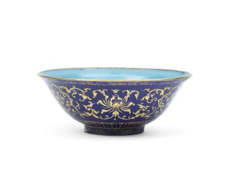A GILT DECORATED BLUE ENAMELLED 'LOTUS' BOWLQianlong four-character seal mark and of the periodPainted in gilt around the ext
