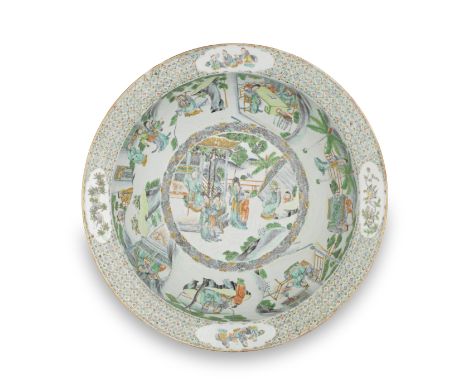 A FAMILLE VERTE BASIN19th centuryThe well and cavetto decorated with scenes of ladies, gentlemen and boys at leisurely pursui