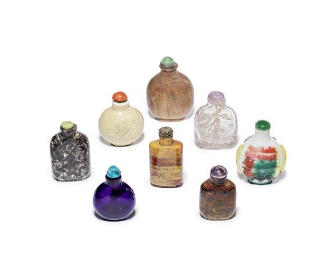 A SELECTION OF GLASS, HARDSTONE, PORCELAIN AND WOOD SNUFF BOTTLES19th centuryComprising: a triple-overlay on white glass bott