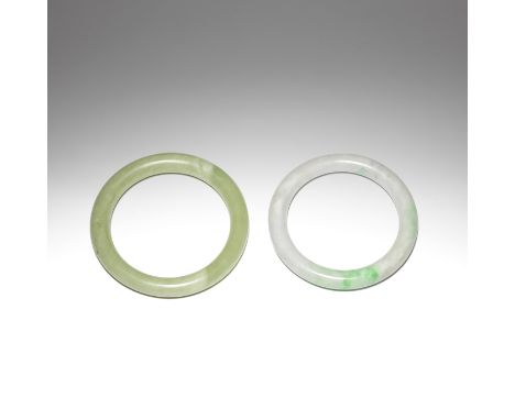 A JADEITE BANGLE AND A JADE BANGLELate Qing DynastyThe jadeite bangle of creamy white tone suffused with apple green flecks a