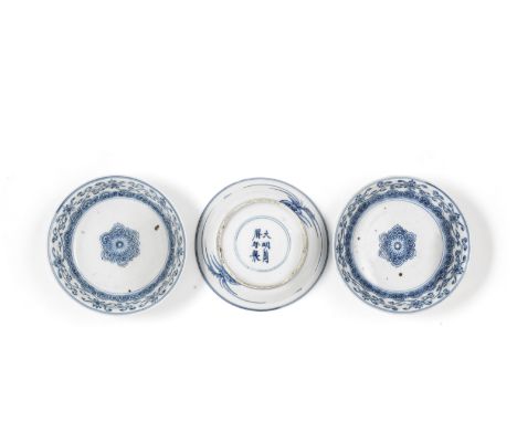 A SET OF THREE BLUE AND WHITE 'LOTUS' BOWLSWanli six-character marks, Qing DynastyEach thinly potted and painted to the well 