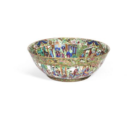 A MASSIVE CANTON FAMILLE ROSE PUNCH BOWL19th centuryThe well brightly enamelled and gilt with a continuous court scene framed