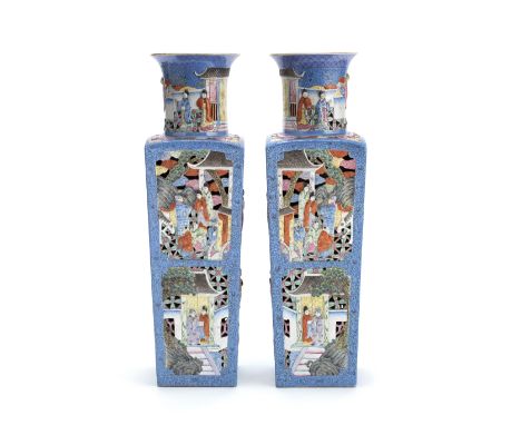 A LARGE MIRROR IMAGE PAIR OF FAMILLE ROSE RETICULATED SQUARE BALUSTER VASESKangxi seal marks, 19th centuryEach side with moul