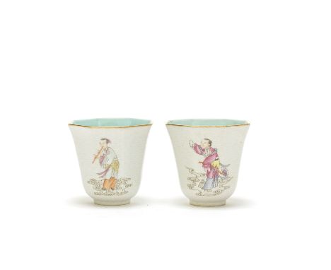 A PAIR OF FAMILLE ROSE 'IMMORTALS' WINE CUPSIron red Xiezhu Zhuren Zao hall mark, Qing DynastyOf flaring octagonal form, each