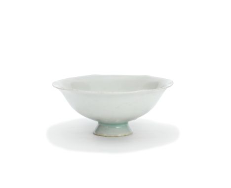 A QINGBAI STEM CUPSong DynastyThe thinly potted shallow cup with rounded sides rising to an everted six-lobed rim, covered in