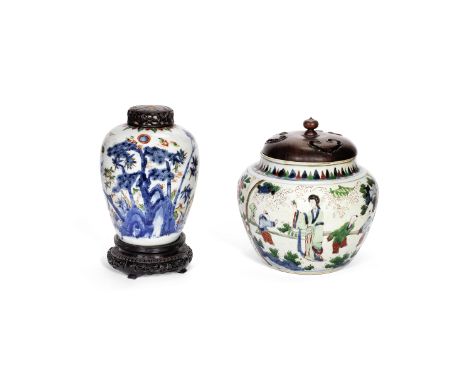 TWO WUCAI JARS17th centuryThe first of oviform shape, decorated with the 'Three Friends of Winter', lamped, wood cover and wo