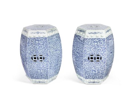 A PAIR OF HEXAGONAL BLUE AND WHITE GARDEN STOOLS19th centuryEach decorated with thick pencil-drawn floral meanders between ap