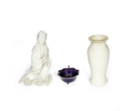 A BLANC-DE-CHINE FIGURE OF GUANYIN, A SOFT-PASTE VASE AND AN AUBERGINE-GLAZED WATER POTKangxi to 19th centuryThe figure of Gu