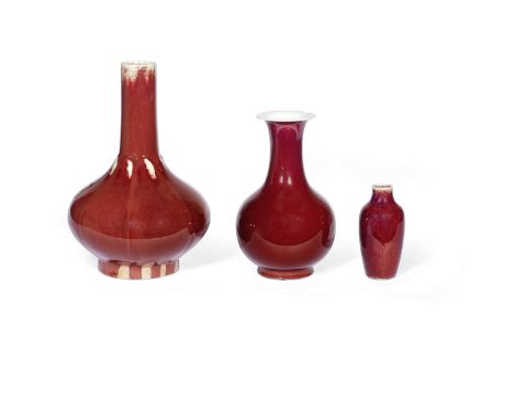 A GROUP OF THREE FLAMBÉ-GLAZED VASESLate Qing DynastyComprising: a lobed pear-shaped bottle with impressed Yongzheng seal mar