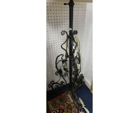 A cast iron standard lamp, a sabre leg chair, piano stool and a mahogany hanging book stand (4).