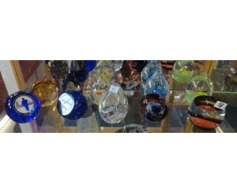 A collection of ten paper weights including Caithness commemorative Royal paperweight, Churchill paperweight etc.