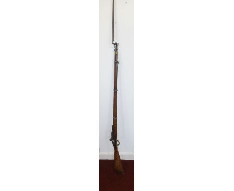 An Enfield Snider Conversion 1851 three band rifle, the steel barrel numbered 1851, with hinged ladder sight, the lock plate 