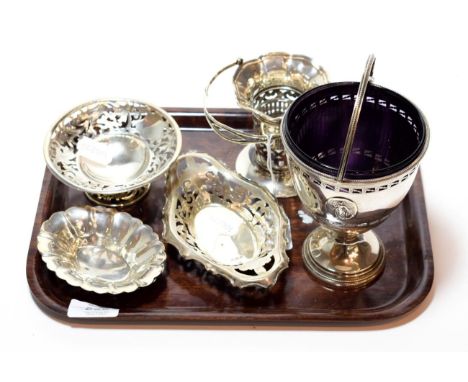 A collection of silver, including: a George V silver sugar-basket, in the George III style, with tapering pierced sides and o