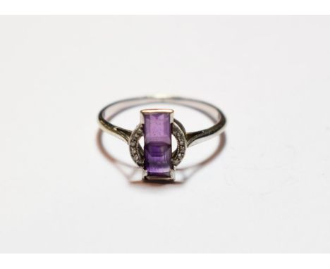 An Art Deco amethyst and diamond ring, finger size O1/2  NB: one diamond deficient .  Gross weight 2.2 grams. 