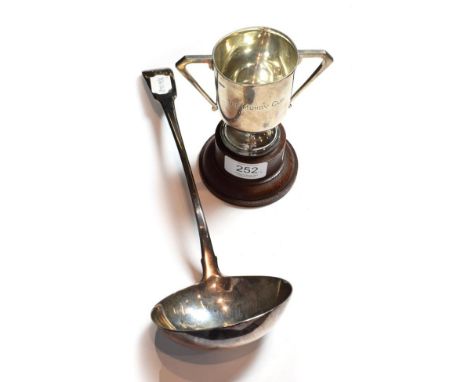 A George III silver soup-ladle, by Eley, Fearn and Chawner, Fiddle pattern, later engraved with an initial; together with: a 