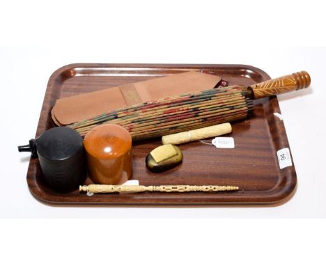 A late 19th century ivory Stanhope and needlecase; a parasol; a late 19th century carved ivory bodkin case; horn snuff box; t