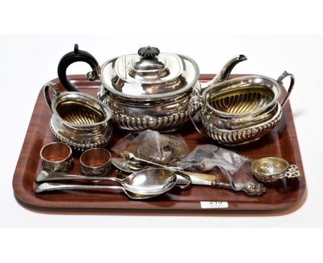 A collection of silver and silver plate, including: a silver-handled shoe horn a silver plated three-piece tea-service, pair 