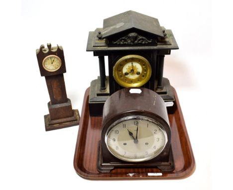 An early 20th century black slate mantel clock; together with an early 20th century Bakelite cased mantel clock; and a miniat