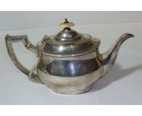 Silver hallmarked (Sheffield 1938) teapot with bone insulators and finial and ribbed handle and makers marks M & W (total wei