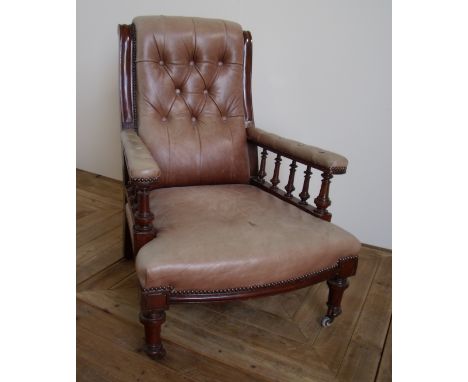 Early 20th C walnut framed easy chair upholstered in button back leather