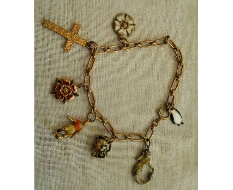 9ct gold open link charm bracelet with a selection of 9ct gold charms including crucifix, Yorkshire Rose and four enameled ch