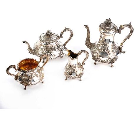 IRISH EMBOSSED 4 PIECE DUBLIN SILVER TEA SET WITH NEO CLASSICAL HEAD AND GRIFFIN SPOUT ON PAN FEET. DUBLIN 1859. MAKER: J.SMI