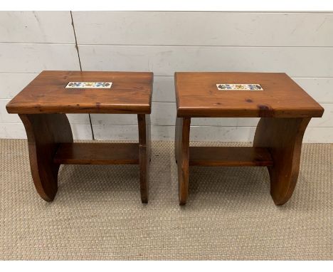 Two wooden stools with a tile to centre 