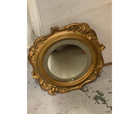 A Round gilt frame mirror with scroll detail