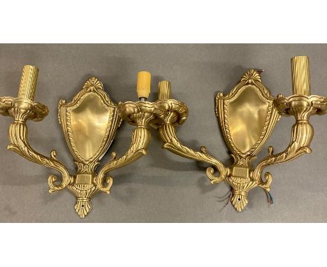 A pair of brass light wall sconces 
