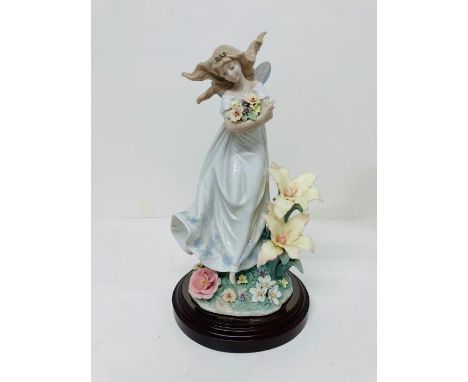 A boxed Lladro porcelain figurine "Mystical Garden" No 6686 Condition Report Has broken pebbles see photos and flower