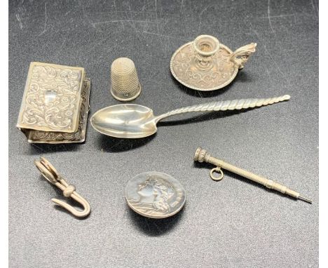 Five assorted silver curios to include matchbox cover, miniature candlestick, thimble etc 