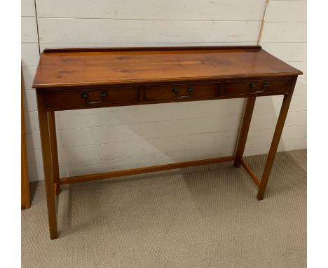 A reproduction console table (H86cm W121cm D35cm)