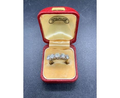 A five Stone diamond ring on 18 ct yellow gold setting