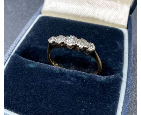 An 18ct gold and platinum five stone vintage diamond ring