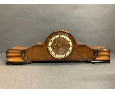 A mantle clock with Westminster chimes.