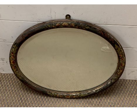 An oval hand painted mirror 